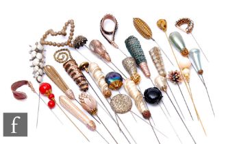 A collection of various hat pins to include gilt metal, sequin and beadwork examples. (39)