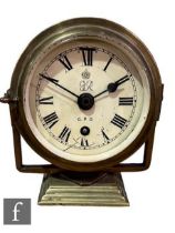 A George V G.P.O circular clock in brass gimble frame on a stepped base, No 43, height 20cm.