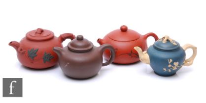 A collection of 20th Century Chinese Yixing teapots, to include two red clay, one brown clay and one