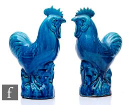 Two late Qing Dynasty Chinese Sancai glazed cockerels, each moulded and raised on rocky outcrop