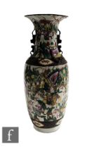 An early 20th Century Chinese vase of ovoid form, rising to a flared neck with scalloped rim,