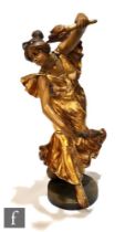 A large early 20th Century Goldschieder Art Nouveau terracotta figure modelled as a lady in a gold