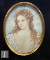 An early 20th Century miniature on celluloid depicting a young woman partly disrobed, oval,