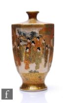 A Japanese Satsuma vase of ovoid hexagonal from, rising from a splayed base, the heavily gilded body