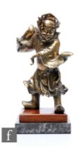 A Chinese cast metal warrior figure dressed in flowing robes with arms raised, lacking weapon,
