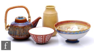 A mid 20th Century Stavangerflint bowl decorated with white slip wavy lines over the brown ground,