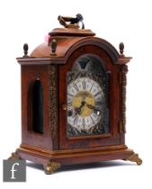 A small 18th Century style walnut cased bracket clock by Wuba, silvered arch dial with moonphase and