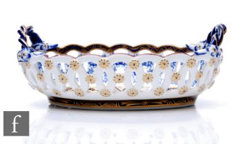 A 19th Century Royal Worcester oval sweet meat dish, formed as a basket with pierced sides and