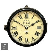 A Smiths circular wall clock in black cast case and frame, single wind and subsidiary seconds