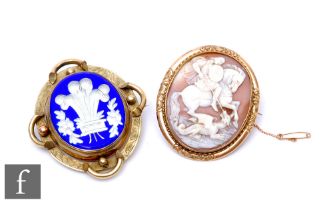 Two 19th Century brooches, to include a yellow metal and shell carved cameo brooch depicting St.