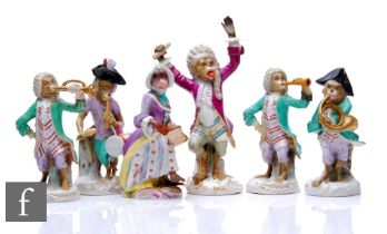 A collection of early 20th Century German porcelain monkey band figures, to include conductor,