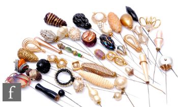 A collection of various hatpins, to include examples with lucite, gilt metal and faux pearl. (47)