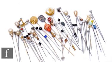 A collection of various hatpins to include gilt metal, enamelled, faux pearl and beadwork