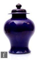 A Chinese late Qing Dynasty Kangxi style monochrome 'Aubergine' glazed baluster jar and cover,