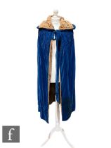 A 1920s/30s vintage blue velvet cloak, with tan velvet interior, ruched shoulder and collar detail