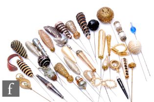 A collection of various hat pins to include faux pearl, gilt metal and sequin examples. (46)