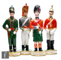 A group of four Clarice Cliff The Old Brigade hand modelled figures of soldiers circa 1952, to