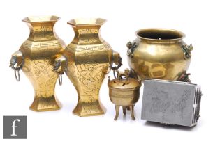 A collection of late Qing Dynasty metalwares, to include a pair of vases with taotie mask handles,