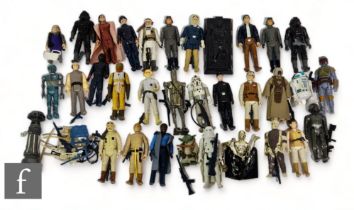 A collection of Kenner Star Wars action figures, mostly complete with accessories. (32)