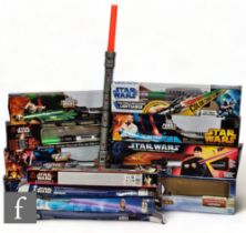 A collection of Hasbro Star Wars lightsabers, to include Revenge of the Sith Jedi Training Mode