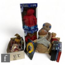 A collection of various ET merchandise, to include Hasbro Interactive ET, various plush toys, a