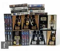 A collection of Star Wars VHS tapes, to include  the original trilogy, Revenge of the Sith, two