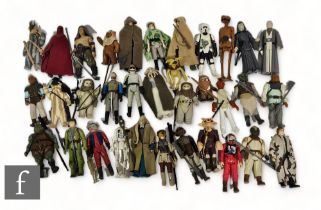 A collection of Kenner Star Wars action figures, mostly complete with accessories. (33)