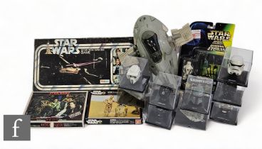 A collection of Star Wars partwork helmet and vehicles, together with a vintage Kenner Slave 1