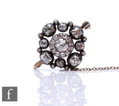 A 19th Century old cut diamond set brooch, central diamond 5.4mm x 5mm, within a diamond set