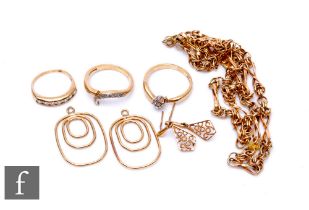 A small parcel lot of assorted 9ct jewellery to include earrings, three rings, a bracelet etc, total
