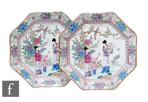 A pair of Chinese late Qing Dynasty famille rose octagonal dishes, decorated with figures and