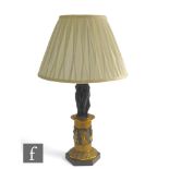 A late 19th to early 20th Century French Empire style table lamp modelled as the three standing