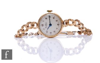 A lady's 9ct hallmarked Bentima manual wind wrist watch, Arabic numerals to a silvered dial to a 9ct