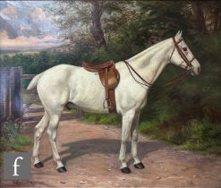 W. VIZARD (LATE 19TH CENTURY) - A portrait of a grey mare standing in a wooded landscape, oil on