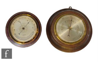 An Edwardian and chequer strung inlaid circular aneroid barometer by C.S.S.A Ltd London, silvered