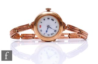 A 9ct hallmarked rose gold manual wind wrist watch, Roman numerals to a white enamelled dial, to a