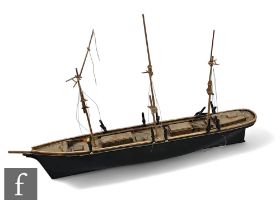 A 20th Century wooden scale of a twin masted barque, painted black, length 90cm.