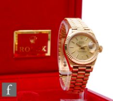 A lady's 18ct Rolex Datejust gilt baton and date facility to a circular champagne dial, case