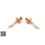 A pair of 18ct drop earrings with a stylised fleur de lys design above twin drops, weight 9.5g,