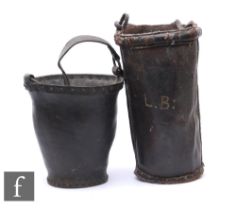 An early 19th Century studded leather fire bucket and a similar example later monogramed LB. (2)