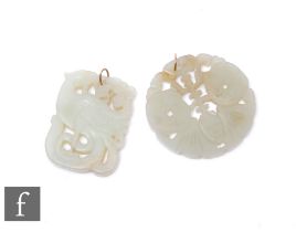 Two carved jade pendants, a circular and a cushioned rectangular example. (2)