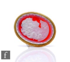 A modern 18ct hallmarked mounted oval hardstone cameo brooch profile of a classical young lady,