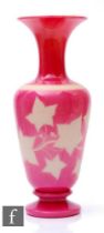 A late 19th Century Richardsons glass vase of baluster form with flared neck, cased in pink over