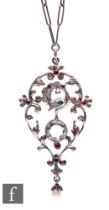 A silver Austro Hungarian open work pendant with central paste stone below central bird set with