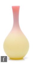 A contemporary Queens Burmese style glass vase of bottle form, with graduated pink to yellow