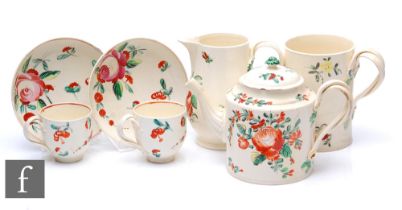 A collection of 18th/19th Century creamware, all with handpainted floral decoration, to include a