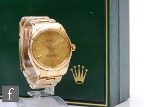 A gentleman's 14ct Rolex Oyster Perpetual wrist watch, gilt batons to a circular champagne dial,