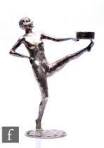 An early 20th Century French silvered Art Deco figure study of a female nude with leg raised and