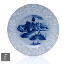 An 18th Century English Bristol Delftware pottery plate circa 1750, the central well decorated in