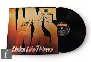 INXS - A signed Listen Like Thieves LP, signed by Michael Hutchence and Jon Farriss. *A Tour